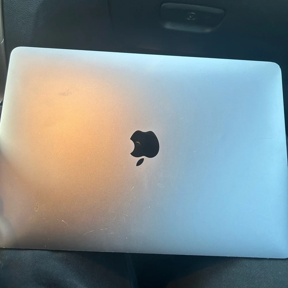 Mac book, will cost $450 to fix do to minor damage but still useable.